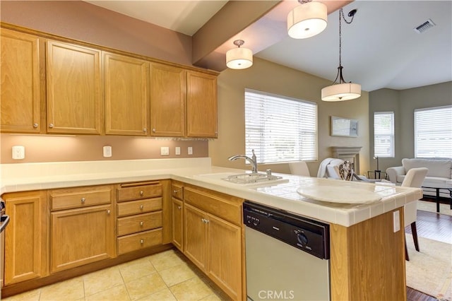 kitchen featuring sink, hanging light fixtures, dishwasher, and kitchen peninsula