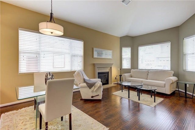 living room featuring dark wood-type flooring