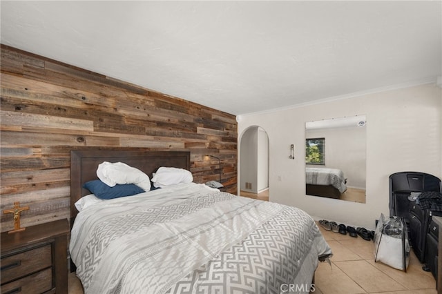 tiled bedroom with crown molding and wooden walls