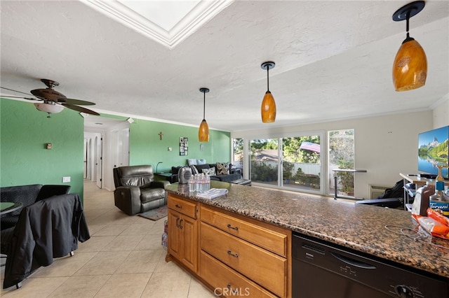 kitchen featuring hanging light fixtures, dishwasher, crown molding, and dark stone counters