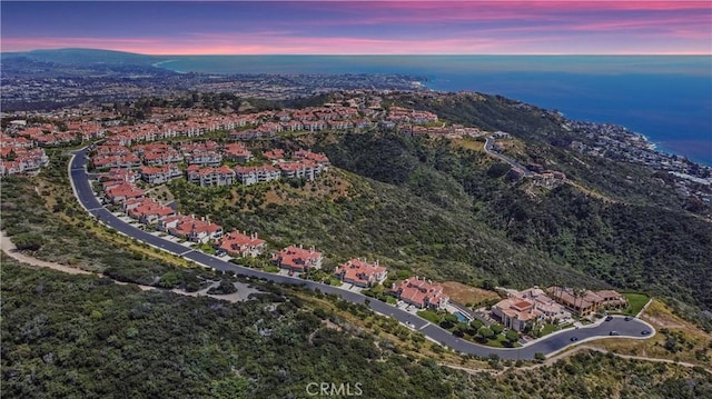 aerial view at dusk with a residential view and a mountain view