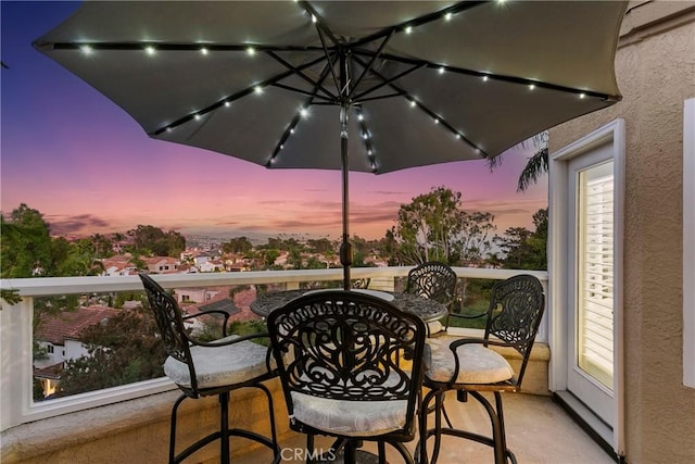 view of balcony at dusk