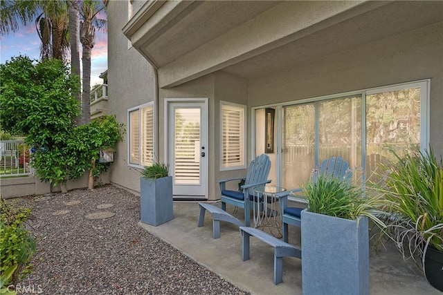 view of patio terrace at dusk