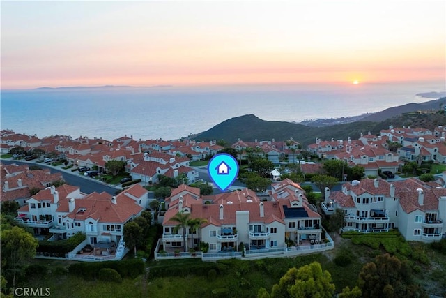 bird's eye view featuring a residential view and a water and mountain view