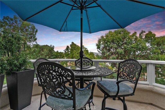 view of balcony at dusk