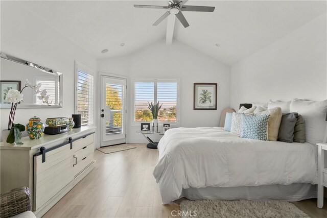 bedroom featuring ceiling fan, access to exterior, light hardwood / wood-style flooring, and vaulted ceiling with beams