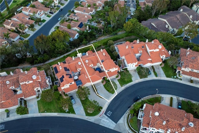 birds eye view of property with a residential view