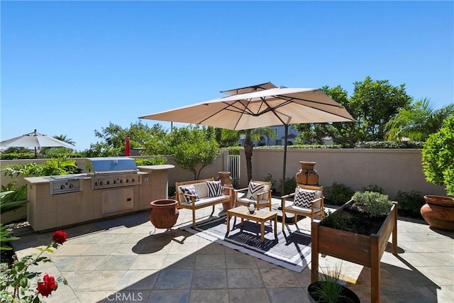 view of patio / terrace featuring a grill, area for grilling, outdoor lounge area, and fence