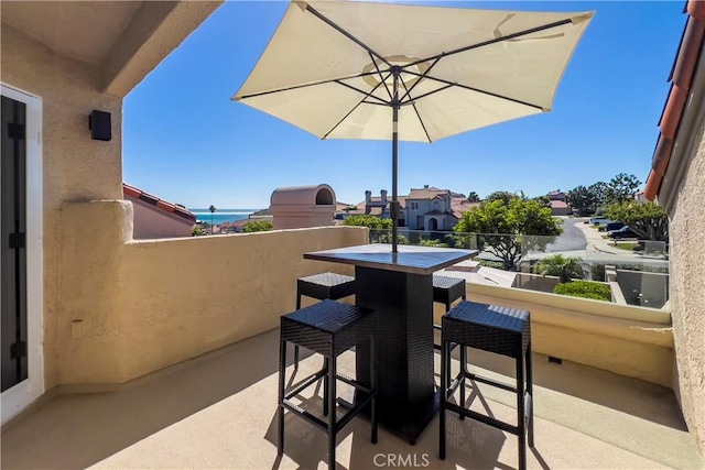 view of patio / terrace with a balcony