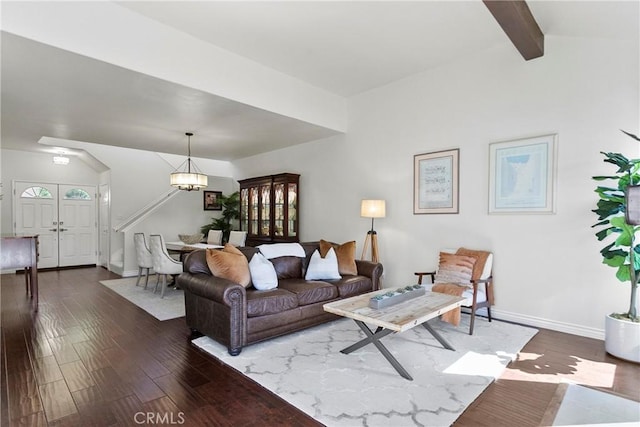 living room with baseboards, dark wood-style flooring, an inviting chandelier, and vaulted ceiling with beams