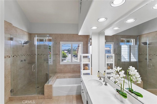 full bathroom with recessed lighting, a shower stall, tile patterned floors, a garden tub, and vanity