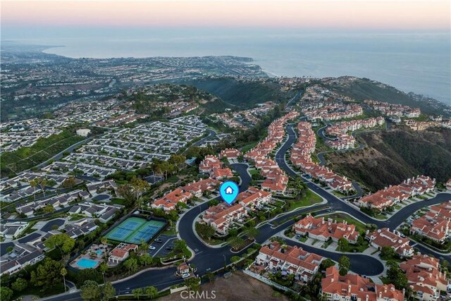 aerial view at dusk with a water view