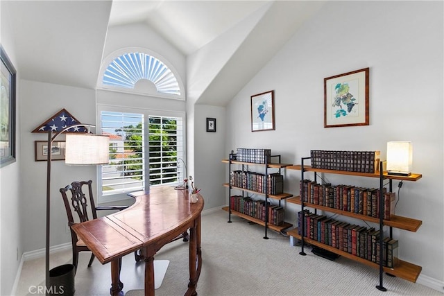 office area with carpet floors and vaulted ceiling