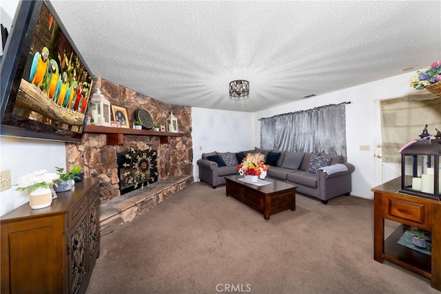 living room featuring a textured ceiling, light carpet, and a fireplace