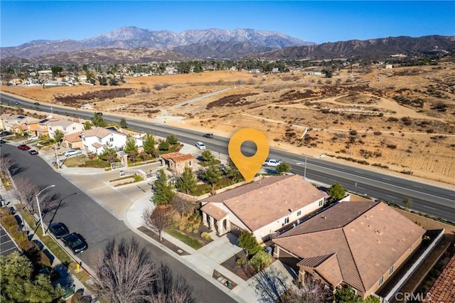 drone / aerial view featuring a mountain view