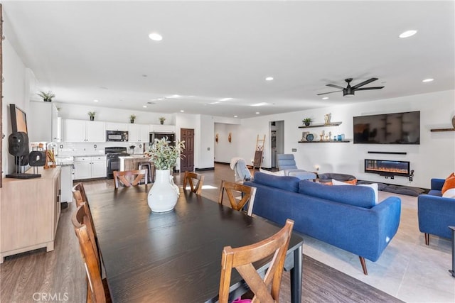 dining space featuring ceiling fan