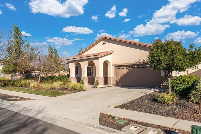 mediterranean / spanish-style house featuring a garage