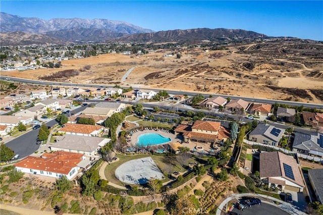 birds eye view of property with a mountain view