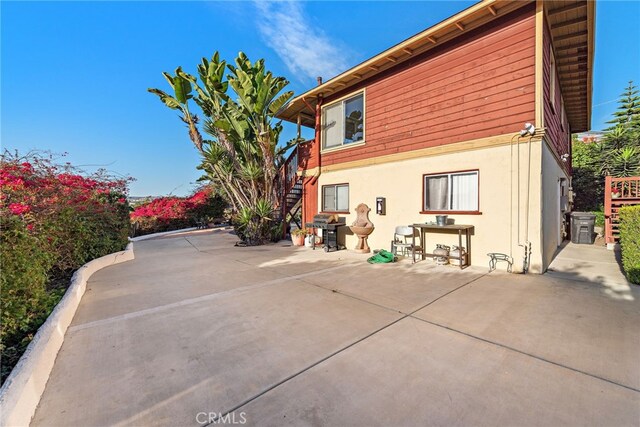 back of house with a patio area