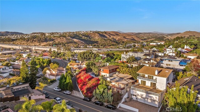 birds eye view of property featuring a mountain view