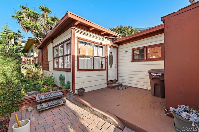 view of side of home with a patio area