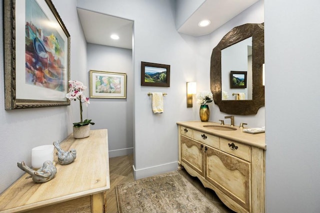 bathroom with wood-type flooring and vanity