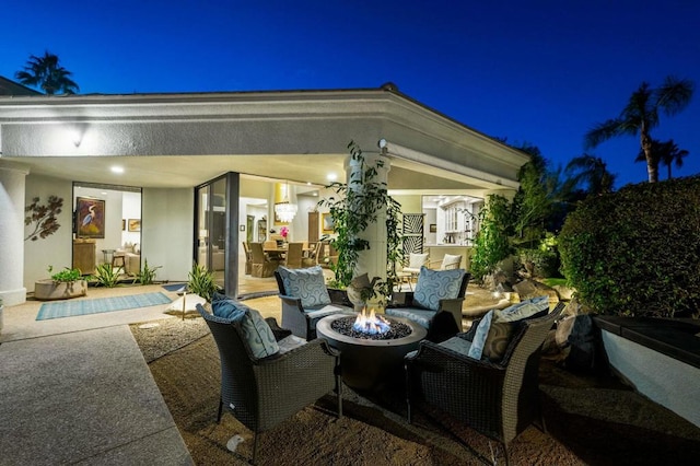 patio at night with an outdoor fire pit