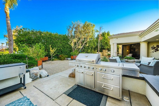 view of patio featuring grilling area, an outdoor living space, and area for grilling