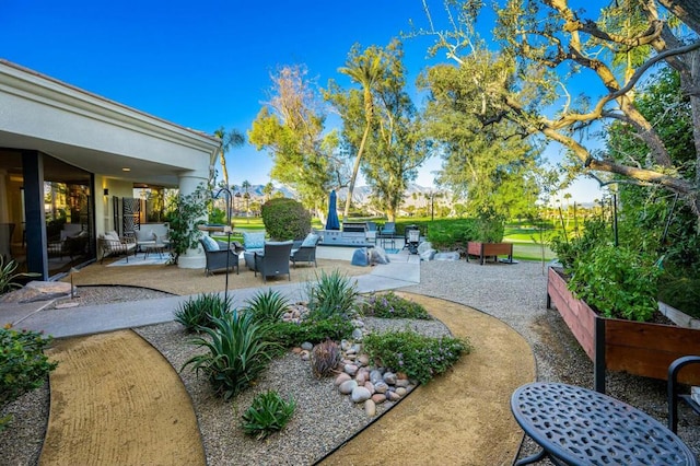 view of yard with an outdoor hangout area and a patio area