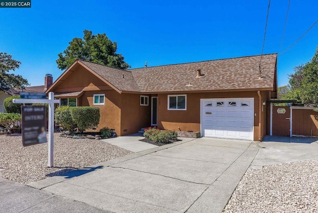 single story home featuring a garage