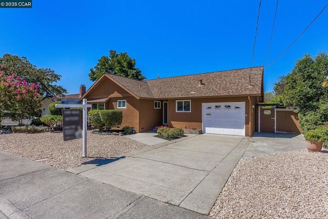 single story home with a garage