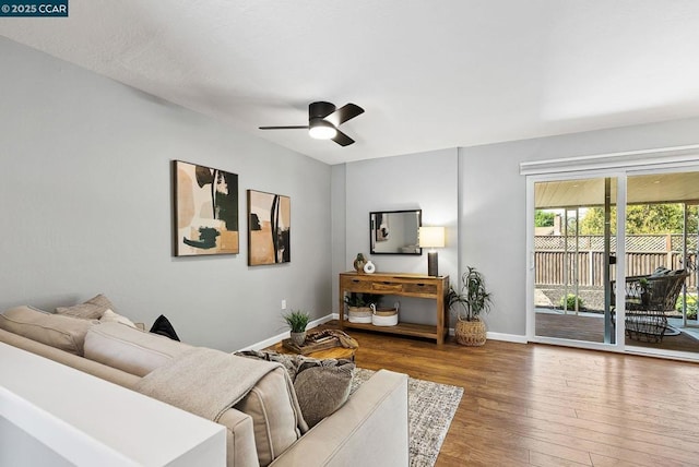 living room with ceiling fan and hardwood / wood-style flooring