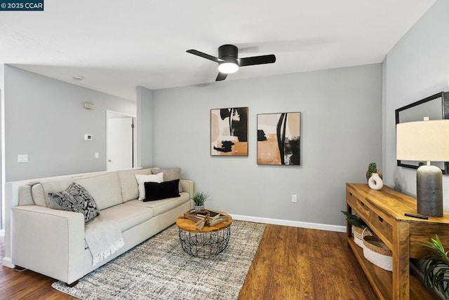 living room with hardwood / wood-style flooring and ceiling fan