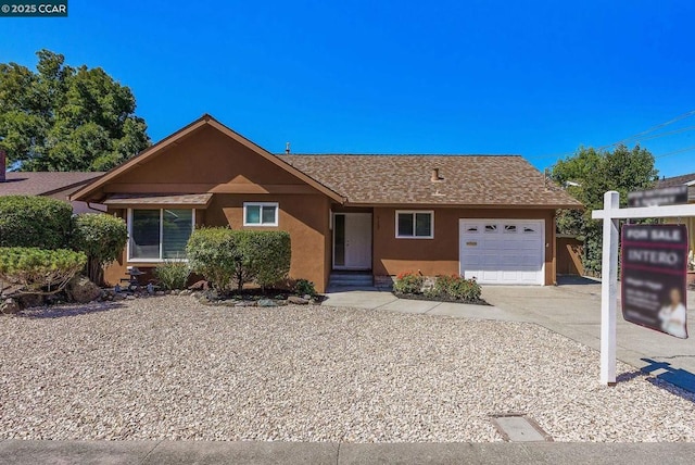 ranch-style home with a garage