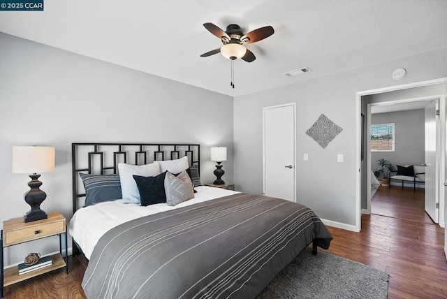 bedroom featuring ceiling fan and dark hardwood / wood-style flooring