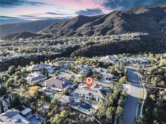 aerial view at dusk with a mountain view