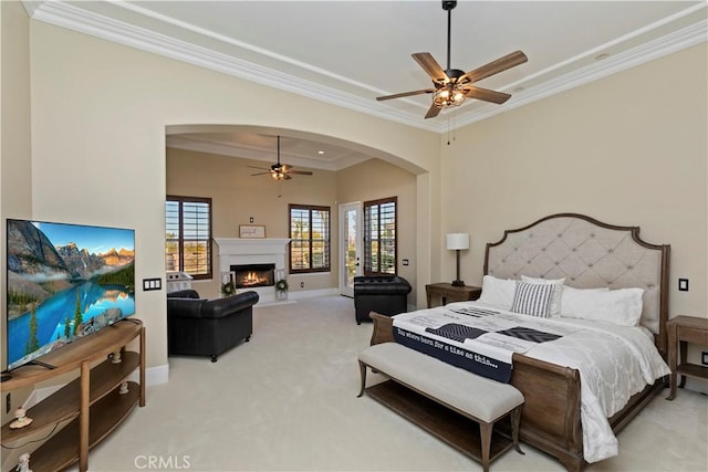 carpeted bedroom with ceiling fan and crown molding