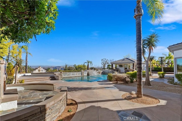 view of swimming pool with a patio area