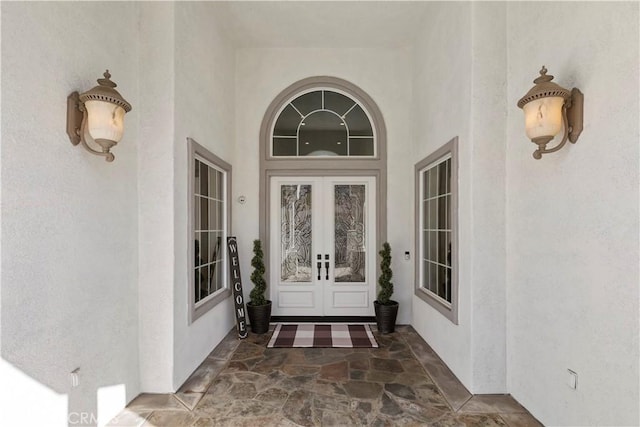 entrance to property featuring french doors