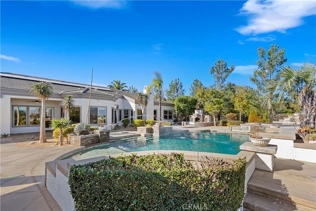 view of pool featuring ceiling fan and a patio