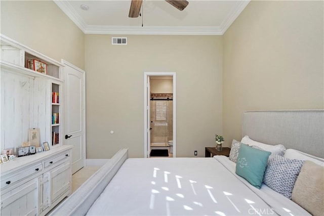 bedroom featuring ceiling fan, crown molding, and ensuite bath