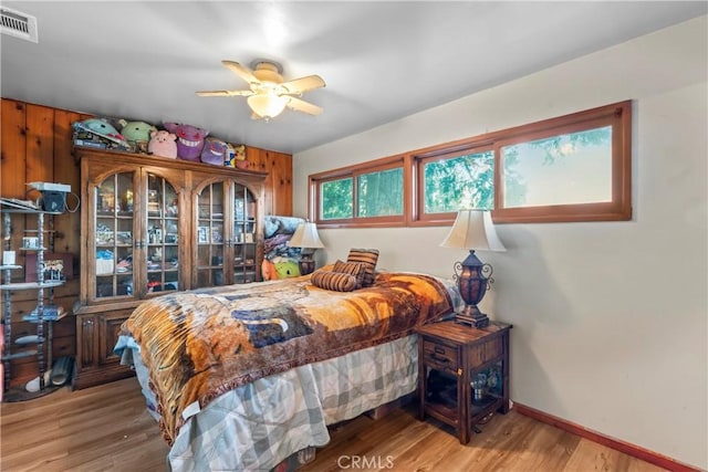 bedroom featuring ceiling fan and wood-type flooring