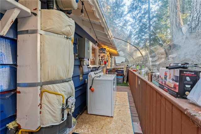 view of home's exterior featuring washing machine and clothes dryer