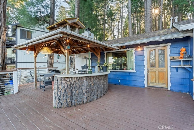 wooden terrace featuring an outdoor bar