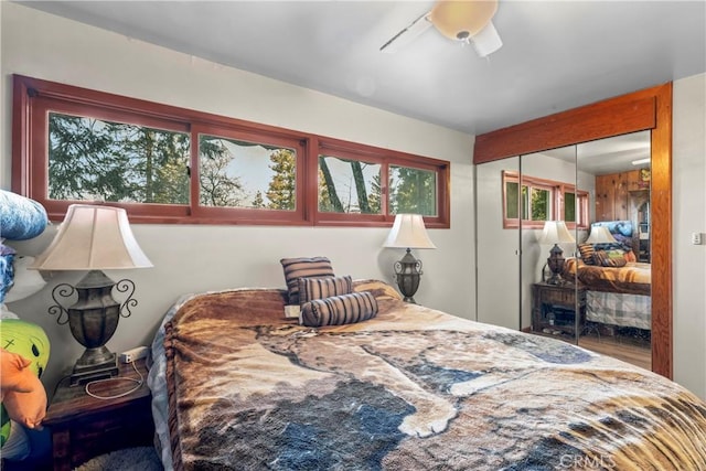 bedroom featuring ceiling fan and a closet