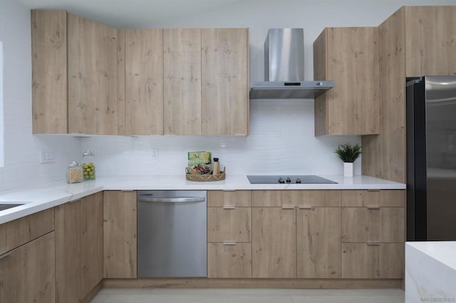 kitchen with decorative backsplash, wall chimney range hood, stainless steel appliances, and light brown cabinetry