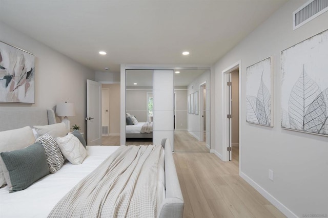 bedroom featuring light hardwood / wood-style flooring