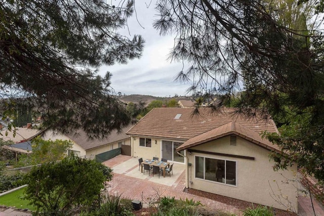 back of property featuring a patio area