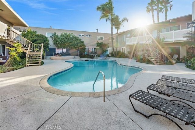 view of pool featuring a patio area