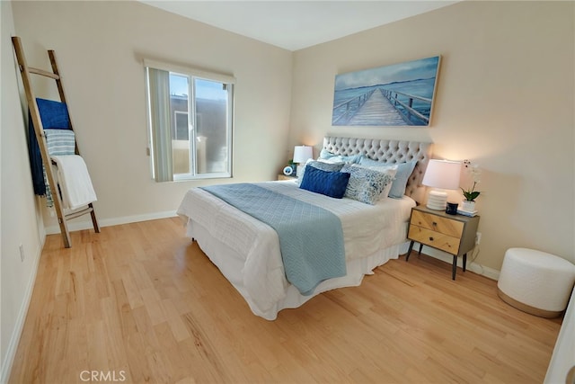 bedroom with light hardwood / wood-style floors